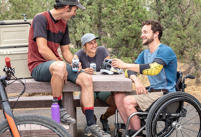 Man-in-Wheel-Chair-with-Friends_840x480